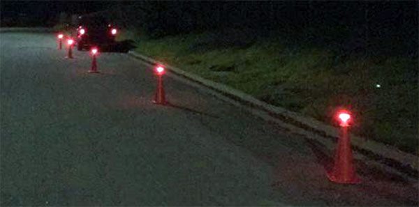Image of cone top adapters being used with PowerFlare lights at night.